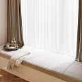 Gray Soft Cushioned Window Seat With Curtains Tray Decorations And Blanket