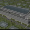 Modern Industrial Factory Building With Large Glass Facade Roof Structure Surrounding Trees And Roads