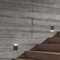 Gray Wood Patterned Wall Interior With Wooden Stairs And Illuminated Wall Lamps