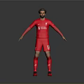 Liverpool Football Player Wearing Red Jersey With Team Logo And Shorts