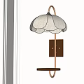 Elegant Petal Shaped Wall Lamp With Beige Shade Dark Trim Brass Pole And Circular Shelf