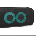 Sleek Black Wireless Speaker With Green Circular Design And Two Units With Ports