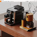 Modern Kitchen Appliances With Black Espresso Maker And Orange Coffee Machine On Wooden Table