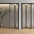 Glass Folding Doors With Black Frame In Modern Interior Featuring Green Plants And Wooden Floor