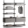 Modern Minimalist Wardrobe With Hanging Rod Shelves Drawers Folded Linens Pillow And Candle