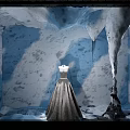 Window Display with Ice Cave Themed Background and Mannequin in Elegant Long Dress