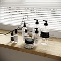 Stylish Bathroom Accessories With Transparent Pump Bottles Lidded Jar And Natural Labels On Wooden Countertop