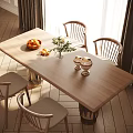 Minimalist Wooden Dining Table Set with Four Chairs Fruit Basket Vase Flowers and Candle Holders