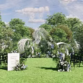 Outdoor Wedding Floral Display with White Blue Blooms Green Foliage and Welcome Sign