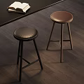 Stylish Black and Brown Bar Stools With Leather Seats And Wooden Legs In Modern Interior