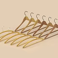 Wooden Clothes Hangers With Metal Hooks In Multiple Natural Tones For Clothing Storage