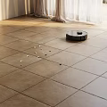 Tile Flooring With Robot Vacuum Cleaning Debris