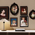 Wall Decor With Various Framed Portraits Table Lamp And Books On Cabinet