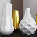 Gold And White Decorative Vases With Geometric Patterns And Modern Design