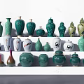 Various Green And White Ceramic Vessels With Decorative Patterns On 3d model