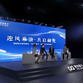 SPD Bank Themed Stage with Illuminated Blue Lighting Branded Display Stands and Digital Screens