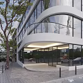 Modern Multi Storey Office Building With Glass Facade Street Trees And Parked Cars