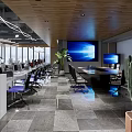 Modern Public Office Space with Open Layout Workstations Computers Greenery and Floor to Ceiling Windows 3d model