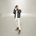 Man Taking Photos With Black Jacket White Top Beige Pants Brown Boots In Light Studio