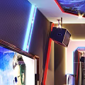 Modern KTV Room Interior With Neon Lights Large Screen TV And Starry Ceiling