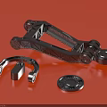 Black Metal Mechanical Bracket With Ring Shaped Part And Circular Toothed Component On Red Background