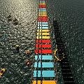 Sunlit Waterfront Swing Door With Colorful Planks And Floating Rings
