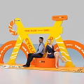 TIME PARK BRC City Photo Spot with Orange Yellow Arched Structure and Couple Sitting