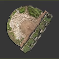 Ancient Amphitheater Ruins With Semicircular Stone Seats And Grass Covered Areas