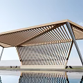 Modern Pergola With Geometric Structure And Wooden Slatted Roof Over Pool