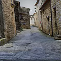Modern View Of Historic Stone Alley With Cobblestone Pathway