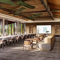 Modern Hotel Lobby With Wooden Ceiling Green Decor Large Windows Long Tables And Central Counter