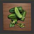 Fresh Whole and Sliced Green Peppers on a Wooden Board