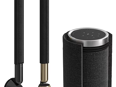 Black Headphones And Cylindrical Speaker With Silver Edge And Small Dots On Top 3d model