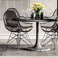 Modern Dining Table Set With Black Chairs Yellow Flowers Wine Glasses Wall Art And Plant