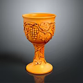 Orange Carved Cup With Grape And Leaf Patterns On Tall Stem