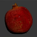 Ripe Juicy Red Pomegranate on Dark Reflective Surface with Glossy Skin