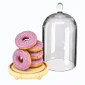 Pink Frosted Donuts with Sprinkles on Wooden Tray and Glass Dome