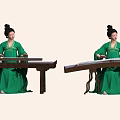 Woman in traditional green dress playing guzheng on wooden table