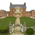 Historic Red Brick House With Two Chimneys Lawn White Fence Gate And Stone Lion Statues