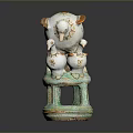 White Ceramic Bird Sculpture With Multiple Birds Standing On Green Base