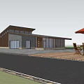 Modern Post Station Surrounded By Trees Near Water With Outdoor Tables Chairs And Sunshade Umbrella