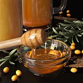 Refreshing Homemade Beverages in Glass Jars with Honey Sea Buckthorn Berries Cinnamon Sticks and Rosemary