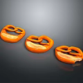 Salted Orange Pretzels Arranged In Row With Glossy Surface On Dark Background
