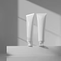 Two White Tubular Daily Washing Products on White Platform with Gray Background and Light Shadow