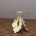 Modern Coffee Table With Glass Top And White Black Leaf Shaped Legs On Wooden Floor