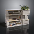 Gray Multi Tiered Cabinet With Open Shelves Dishes And Potted Plant On Top