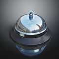 Shiny Chrome Plated Service Bell With Silver Reflective Surface And Black Base