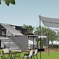 Outdoor Container Building Lounge Area With Lawn Tables Chairs And Decorative Lights