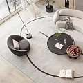 Curved Beige Sofa and Black Coffee Table Set with Armchair Floor Lamp and Plant on Rug