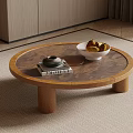 Round Wooden Coffee Table with Teapot Books and Fruit Bowl in Modern Living Room